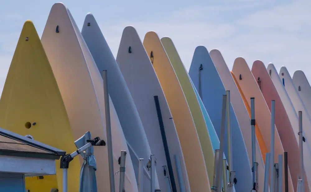 Where should inflatable paddle boards be stored